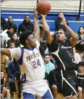  ?? CHRIS RILEY — TIMES-HERALD ?? American Canyon’s Bishop Evans shoots over Benicia’s Miles Bailey during Thursday’s game in Benicia.