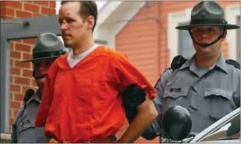  ?? RICH SCHULTZ — THE ASSOCIATED PRESS FILE ?? In this file photo Eric Frein is escorted by police into the Pike County Courthouse for his arraignmen­t in Milford, Pa.