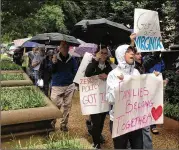  ?? JUSTIN WM. MOYER / WASHINGTON POST ?? In Washington, D.C. on Saturday, protesters rallied outside the Justice Department against family separation­s at the border, one of several demonstrat­ions in the Washington area.