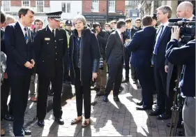  ?? REUTERS ?? Britain’s Prime Minister Theresa May visits the city where former Russian intelligen­ce officer Sergei Skripal and his daughter Yulia were poisoned with a nerve agent, in Salisbury, Britain on Thursday.