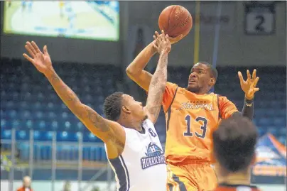  ?? JASON MALLOY/THE GUARDIAN ?? Island Storm forward Du’Vaughn Maxwell takes a shot over Halifax Hurricanes forward Billy White during National Basketball League of Canada action at the Eastlink Centre.