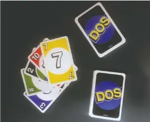  ?? THE ASSOCIATED PRESS ?? Mattel’s new card game, Dos, is displayed Monday in New York. Mattel is launching the new card game next month in hopes of giving its nearly 50-year-old Uno brand a second life. Dos has similar rules as Uno, except players make two piles of cards and...