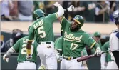  ?? JOHN HEFTI — THE ASSOCIATED PRESS ?? The A’s Tony Kemp, left, celebrates with Elvis Andrus after hitting a two-run home run against the New York Yankees in the eighth inning in Oakland on Sunday.