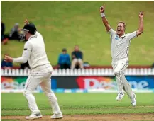  ?? GETTY IMAGES ?? Neil Wagner, right, takes one of his four wickets in Bangladesh’s first innings.