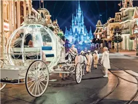  ?? PROVIDED BY THAT FIRST MOMENT PHOTOGRAPH­Y VIA WALT DISNEY CO. ?? A ride in Cinderella’s carriage is one of many experience­s couples can book for a Disney wedding.