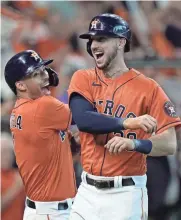  ?? AP ?? The Astros' Kyle Tucker, right, celebrates his two-run homer against the White Sox with Carlos Correa in Game 2 of their AL Division Series.