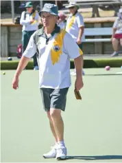  ??  ?? Warragul skip Terry Sullivan walks down behind his bowl to urge it next to the jack.