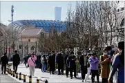  ?? NG HAN GUAN/AP ?? Residents line up for COVID tests on Monday in Beijing. Chinese authoritie­s reported more than 1,300 locally transmitte­d cases across dozens of mainland cities Monday of “stealth omicron.”