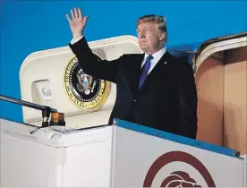  ?? EVAN VUCCI THE ASSOCIATED PRESS ?? U.S. President Donald Trump arrives at the Paya Lebar Air Base in Singapore on Sunday for the summit.