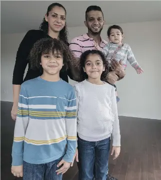  ?? DAVE SIDAWAY ?? Barjas Alsabbagh, 7, Sara Alsabbagh, 9, mom Nour Aburramada­n, dad Ayman Alsabbagh and Celine Alsabbagh, 10 months, made it to Canada via the U.S. from Gaza to their new home in Brossard.