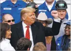  ?? ALEX BRANDON ASSOCIATED PRESS ?? President Donald Trump pumps his fist Wednesday after signing an overhaul of the North American trade agreement with Canada and Mexico at the White House.