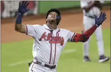  ??  ?? Atlanta Braves’ Ronald Acuna Jr. reacts after hitting a solo home run during the third inning of the team’s baseball game against the Miami Marlins, on Thursday, in Miami. AP PHOTO/LYNNE SLADKY