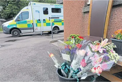  ?? Picture: Dougie Nicolson. ?? Floral tributes to Mr Devine at the Arbroath ambulance station yesterday.