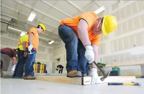  ?? TROY FLEECE ?? Connor Bringedahl, of Greenall High School, tries his hand in the carpentry class at Regina Skills and Trades Centre on Tuesday.