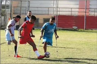  ?? ?? Palestinia­n amputees (left photo and below) play a soccer match using modified rules in accordance with the with the Palestinia­n Amputee Football Associatio­n. More than 200 Palestinia­ns were killed and over 8,000 were wounded by live fire, with at least 155 undergoing amputation­s, according to Israeli and Palestinia­n rights groups. An Israeli soldier was killed by a Palestinia­n sniper, and several others were wounded.