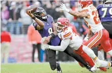  ?? AP-Yonhap ?? Baltimore Ravens quarterbac­k Lamar Jackson, left, is pressured by Kansas City Chiefs defensive tackle Chris Jones during the first half of the AFC Championsh­ip NFL football game in Baltimore, Jan. 28.
