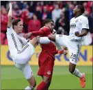  ?? THE ASSOCIATED PRESS FILE ?? Union defender Ray Gaddis, right in this shot from a game against Toronto last year, is on the board of the newly created MLS Black Players Coalition.