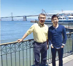  ??  ?? With his dad, Hans Sy, in San Francisco : “Go spread your wings and do what you think you can do best,” Hans told Howard.