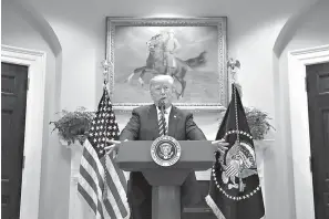  ?? AP Photo/Susan Walsh ?? ■ President Donald Trump talks about immigratio­n and border security Thursday from the Roosevelt Room of the White House in Washington.