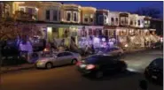  ?? PATRICK SEMANSKY — THE ASSOCIATED PRESS ?? In this photo, row houses in the Hampden neighborho­od of Baltimore show off Christmas decoration­s.