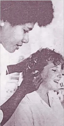  ?? Picture: FT FILE ?? Anarieta Bose teaches one of her beauty student, 16-year-old Diane McCaw of Internatio­nal Secondary School, tips on hair-styling at her school in Suva.