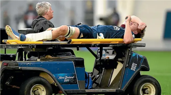  ?? PHOTOSPORT ?? Highlander­s captain James Lentjes is taken from field after suffering a serious leg injury during the loss to the Rebels in Dunedin.