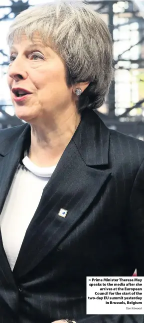  ?? Dan Kitwood ?? &gt; Prime Minister Theresa May speaks to the media after she arrives at the European Council for the start of the two-day EU summit yesterday in Brussels, Belgium