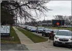  ?? ?? Vehicles lined up for the gun buyback in Southfield.