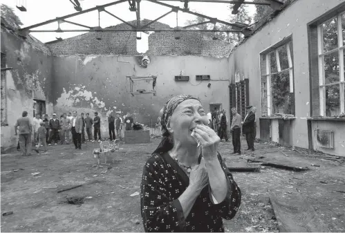  ?? Viktor Drachev/agence France-presse/getty Images ?? A woman cries in Beslan, Russia, on Sept. 5, 2004.