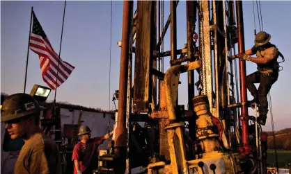  ?? Photograph: Daniel Acker/Bloomberg/Getty ?? Workers at a Chesapeake Energy natural gas drilling site in Bradford County, Pennsylvan­ia.