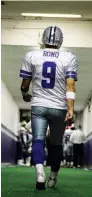  ?? ASSOCIATED PRESS FILE PHOTO ?? Dallas Cowboys quarterbac­k Tony Romo walks down the tunnel to the playing field at Texas Stadium before a home game. Romo is retiring rather than trying to chase a Super Bowl with another team after losing his starting job with the Cowboys.