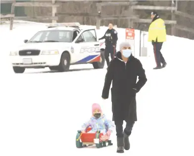  ?? JACK BOLAND / POSTMEDIA NETWORK ?? Toronto police turned away people with sleds from the ski and snowboard hill at Earl Bales Park this month.