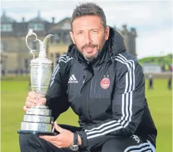  ?? Picture: SNS. ?? Derek McInnes took time out to relax on the Swilcan Bridge with the Open’s Claret Jug.