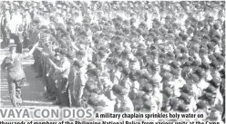  ?? PHOTO BY RUY L. MARTINEZ ?? VAYA CON DIOS
A military chaplain sprinkles holy water on thousands of members of the Philippine National Police from various units at the Camp Crame Transforma­tion Oval in Quezon City on Friday during send- off ceremony for the security task force...