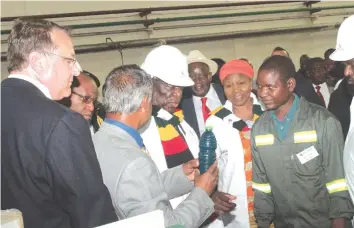  ??  ?? President Mnangagwa is shown a detergent produced by Willowton Zimbabwe during a tour of the company's plant in Mutare recently.