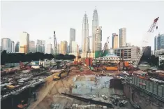  ??  ?? Malaysia’s constructi­on sector will likely see more contract awards in the near future as major infrastruc­ture projects kick into high gear next year, analysts say. — Reuters photo