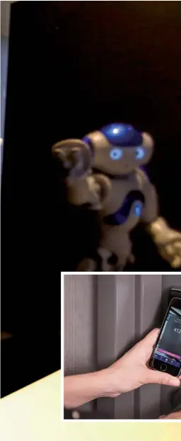 ??  ?? Left and below: A robot concierge at Henn-na Hotel in Japan; and a smartphone room key