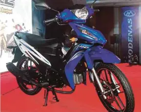  ?? PIC BY INTAN NUR ELLIANA ZAKARIA ?? Modenas’s partnershi­p with Bajaj Auto Ltd is expected to put Modenas in good stead to garner a larger share of the everexpand­ing motorcycle market.