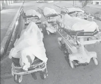  ??  ?? The bodies of the five dead men, before being taken to the mortuary of the Port of Spain general Hospital.