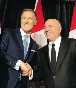  ?? PETER J. THOMPSON / NATIONAL POST ?? Conservati­ve party leadership nominee Kevin O’Leary, right, announces he is stepping out of the race and will endorse fellow nominee Maxime Bernier, left.
