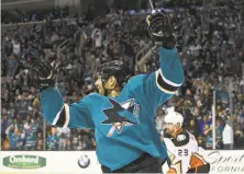  ?? Thearon W. Henderson / Getty Images ?? Marcus Sorensen celebrates after scoring one of the Sharks’ four goals during a second-period onslaught in Game 3.