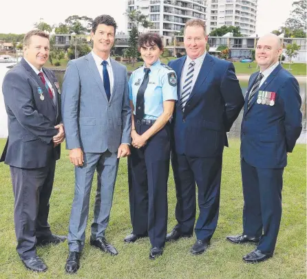  ??  ?? Sgt Todd Miller, Snr Sgt Simon Garrett, Snr Const Catherine Brown, Snr Sgt Peter Robb and Sgt John Carey at the QPS service in Broadbeach Waters where they were given awards for their work in solving the murder of Daniel Dwyer. Picture: RICHARD GOSLING