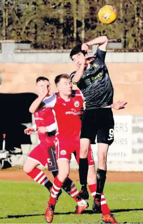  ??  ?? No way through Above, Jason Marr and Kyle Banner combine to thwart Rovers’ striker George Newel while below, Dom Docherty is foiled by Michael Hardie