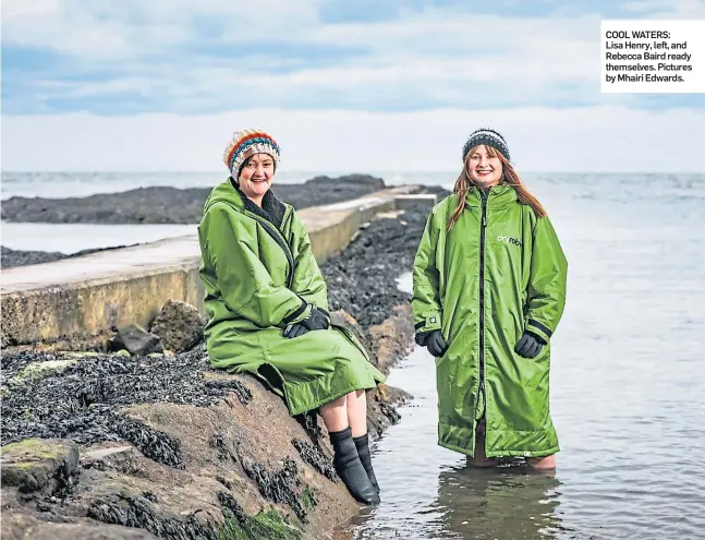  ?? ?? COOL WATERS: Lisa Henry, left, and Rebecca Baird ready themselves. Pictures by Mhairi Edwards.