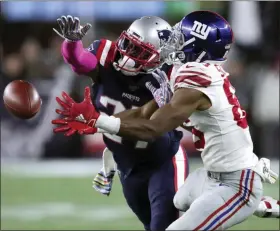  ?? CHARLES KRUPA — THE ASSOCIATED PRESS ?? New England Patriots defensive back J.C. Jackson, left, breaks up a pass intended for New York Giants wide receiver Darius Slayton in the second half of an NFL football game, Thursday in Foxborough, Mass.