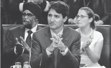  ?? SEAN KILPATRICK / THE CANADIAN PRESS ?? Prime Minister Justin Trudeau, Defence Minister Harjit Sajjan and Foreign Affairs Minister Chrystia Freeland take part in North Atlantic Council working session at the NATO summit in Brussels on Wednesday.