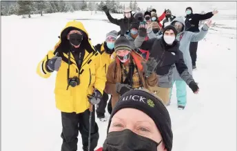  ?? Tauck / Contribute­d photo ?? A Tauck guide takes a selfie of a group tour at Yellowston­e National Park in Wyoming last month.