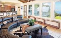  ?? Ethan Tweedie ?? THE RANCH RETREAT at Kahua Ranch features splendid panoramic views from a comfy leather couch in the living room.