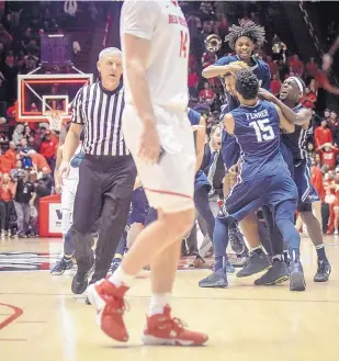  ?? ROBERTO E. ROSALES/JOURNAL ?? Nevada players celebrate their victory in the Pit last season, coming back from a 25-point deficit to beat the Lobos. The Wolf Pack will not visit Albuquerqu­e next season.