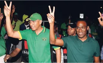  ?? FILE ?? Dr Nigel Clarke (right) and JLP leader, Prime Minister Andrew Holness, after the preliminar­y vote count in NW St Andrew.